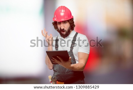 young man worker with a tablet
