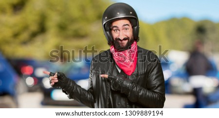 motorbike rider pointing sign