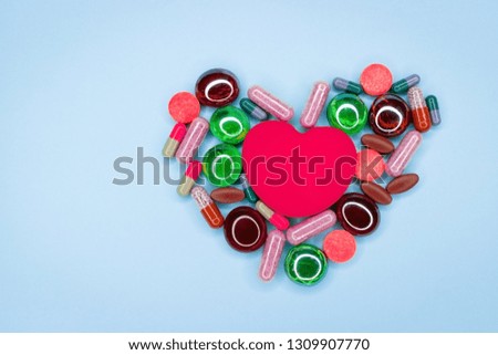Heart from different pills, pills. Different pills laid out in the form of heart on a white background.