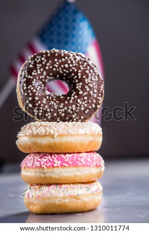 Sweet  donuts isolated over waving american flag