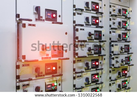Electrical switch gear ,Digital meter at Low Voltage motor control center cabinet in coal power plant. blurred for background. 
