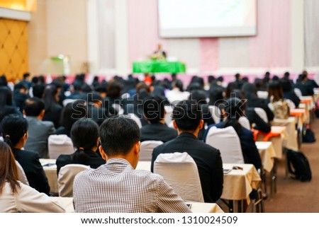 Soft focus photo of people participating conference listening to the speaker in conference room