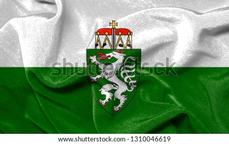 Realistic flag of Styria on the wavy surface of fabric
