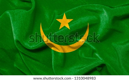Realistic flag of Mauritania on the wavy surface of fabric