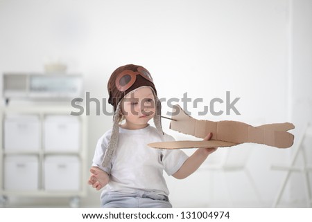 happy boy play in airplane  indoors Royalty-Free Stock Photo #131004974