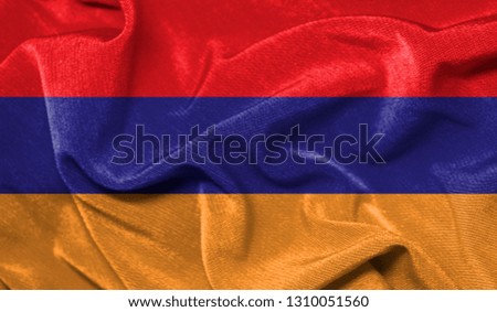 Realistic flag of Armenia on the wavy surface of fabric