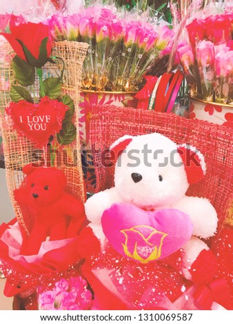 Bears with roses flowers bokeh with valentine.