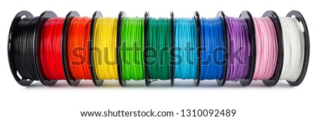 colorful bright wide panorama row of spool 3d printer pla abs filament plastic material isolated on white background Royalty-Free Stock Photo #1310092489