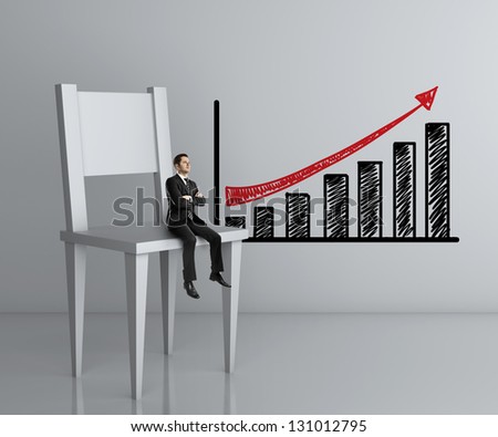 man sitting a big chair and chart on wall