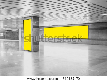 Advertising Billboard mockup panoramic and vertical,yellow light box showcase in subway,display empty space for text design message or media content,Commercial concept business and advertise media