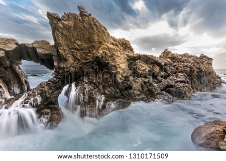The power of the sea crashing to the cliffs create amazing and abstract views like this, thousand of water drops through the air at Anzota Caves cliff walk at Arica. Pacific Ocean smashing the cliffs
