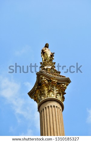 The Golden Blessed Virgin Mary,mother of Jesus on the blue sky
