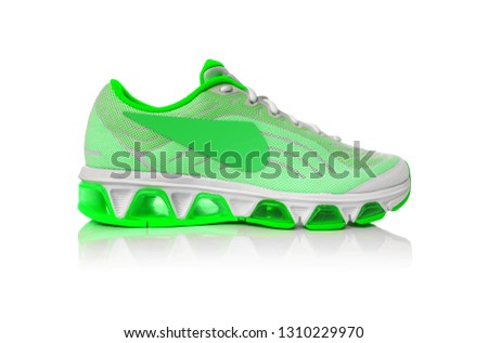 Unbranded modern sneakers isolated on a white background. Lime or green sneakers.