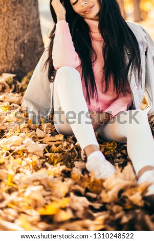 Beautiful woman drink coffee sitting in the park.