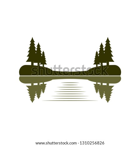 reflections of pine trees at the bank of a lake 