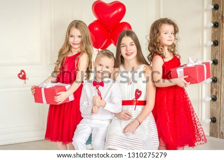 Cute children with a gift and hearts. Valentine's Day