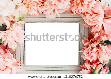 Pastel wooden frame decorated with coral peonies flowers, empty space for text