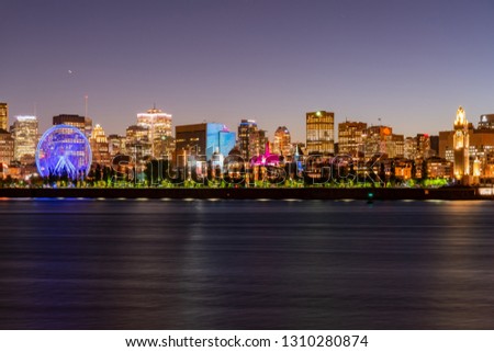 Night view of the Montreal city skyline, city hall with St Lawrence river at Quebec, Canada