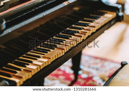 Damaged piano. Very old piano keys. A classic musical instrument. Antique. Keyboard instrument.