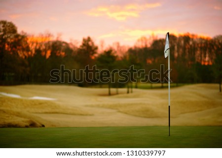 View over golf course at sunset.
