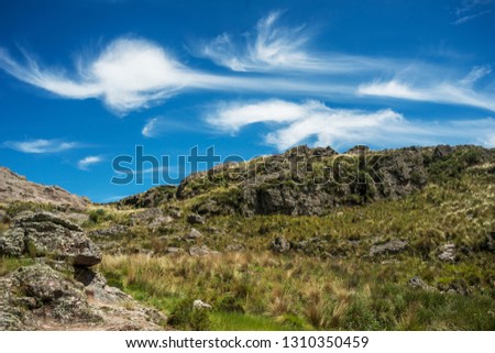 strange cloud formations that fly over the stone mountains