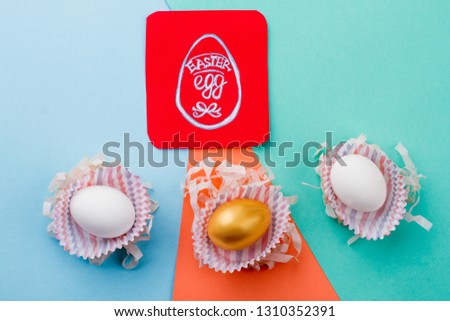 Easter eggs on colorful background. Image of egg on red paper card. History of Easter.
