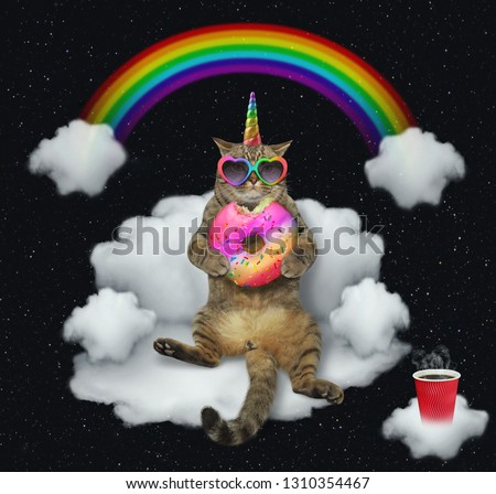 The cat unicorn in sunglasses with a color donut is sitting on the cloud like a divan. The cup of coffe is next to him. Stars background.