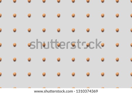 organic brown eggs on grey background, seamless pattern