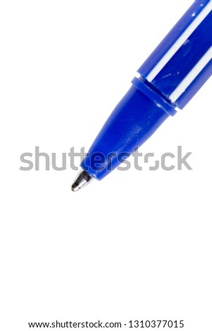 macro, blue plastic pen on white paper