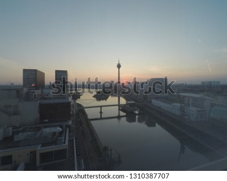 Duesseldorf sunrise over the port with skyline view and tower, rhein reflection of sunsick building shadow - picture 7