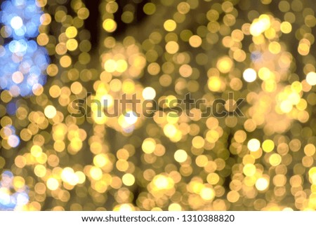 Close-up gold christmas lights blur background. Christmas street lights.