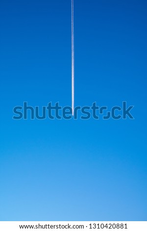background space in the sky picture showing a line from airplane that is flying dividing the sky