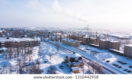 Aerial winter view of Kiruna, the northernmost town in Sweden, province of Lapland, winter sunny picture shot from drone
