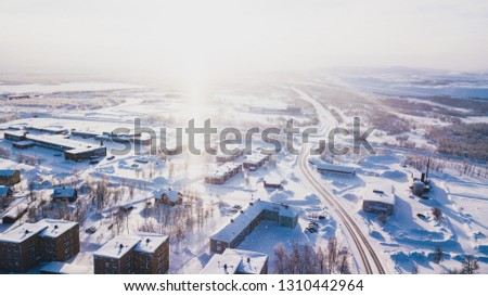 Aerial winter view of Kiruna, the northernmost town in Sweden, province of Lapland, winter sunny picture shot from drone
