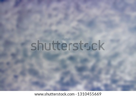 Blurred sky background concept; blurred picture of heavy cloud in the sky.