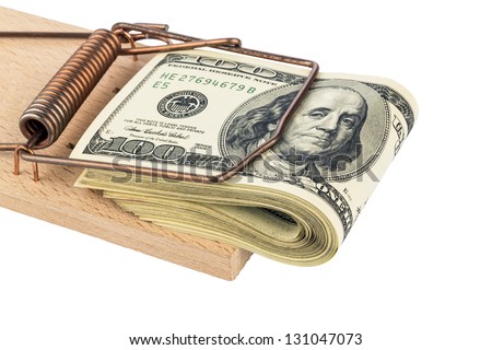 u.s. dollar bills in a mousetrap. symbolic photo for debt