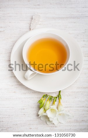Cup of tea with spring flower
