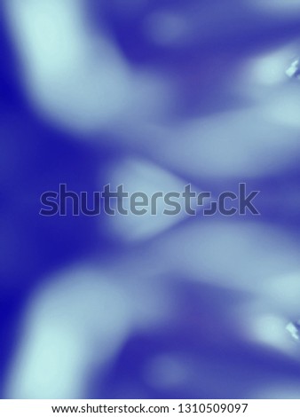 Heart shaped out of focus lights coming from the mother nature with abstract background of Blue color. Abstract background of Blue and white color. Good for Valentines Day celebrations. 