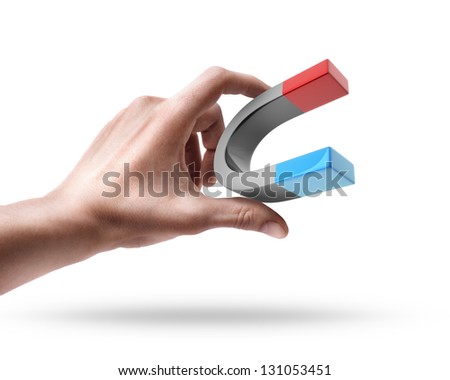 Man's hand holding magnet isolated on white background
