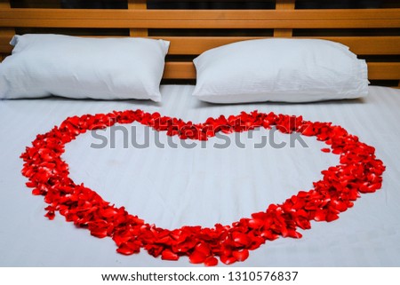 Red heart-shaped roses with white mattresses