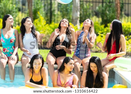 Group of friends at a summer pool party