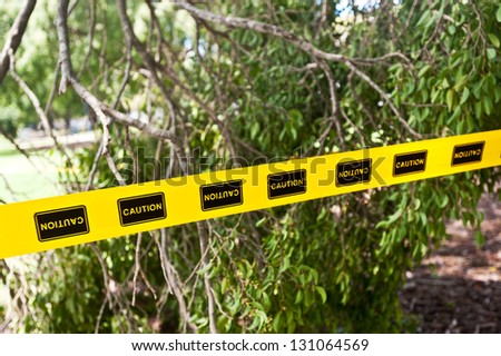 caution tape in a park after a storm