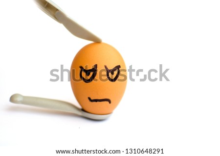 brown evil egg with a small knife and a spoon on white background, painted face