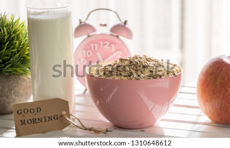 GOOD MORNING label with oatmeal cereal  breakfast on wooden table top.