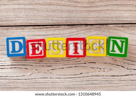 Wooden toy Blocks with the text: design