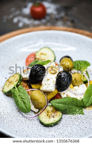 Delicious Healthy Greek Salad on Wooden table background, Food Style Photography for Restaurant menu