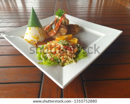 corn rice with tuna and shrimp steak and vegetable salad