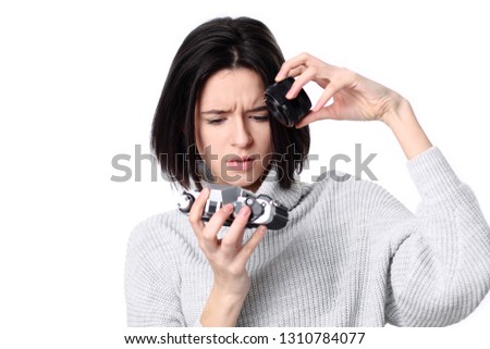 Portrait of a smiling young woman holding retro camera