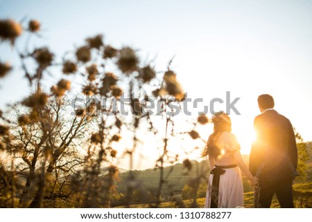 Beautiful wedding couple posing outdoor