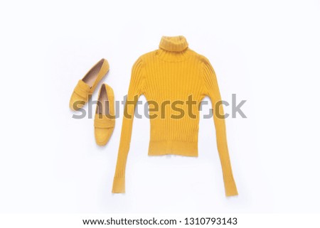 Yellow knitted sweater with yellow shoes on white background 
